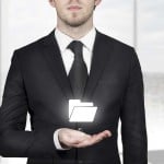 Imilian bigstock-Businessman-Holding-Folder-Sym-68762785-1000