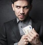 olly2 bigstock-dishonest-man-puts-money-in-th-46496812-W350
