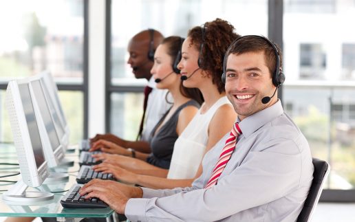 Smiling Businessman Working In A Call Center