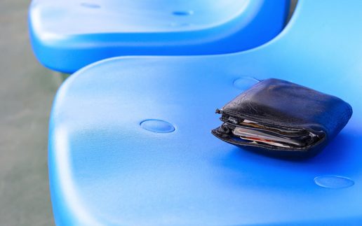 lost wallet lying on a stadium seat
