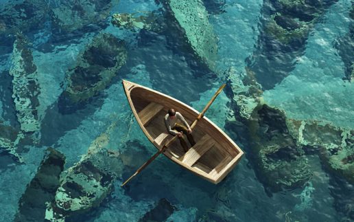 boat sails through the graveyard of sunken boats