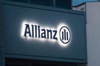 Berlin, Germany - August 15, 2018: Lighted Allianz logo and sign in Berlin. Allianz is a European financial services company headquartered in Munich, Germany.