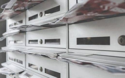 bigstock-Modern-Mailboxes-Filled-Of-Fly-397223633_516
