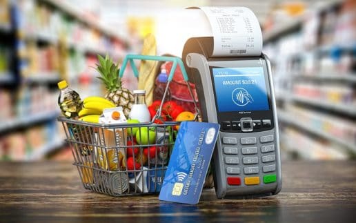 Buying food and drink online. Shopping basket with food and POS
