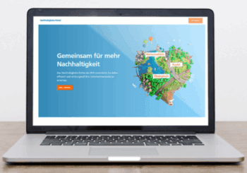 Startseite des DG Nexolution Nachhaltigkeitsportals auf silbernem Laptop.