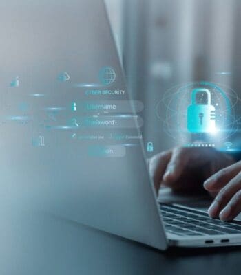 Eine Person interagiert mit einem Laptop, während digitale Elemente im Bereich der Cybersicherheit angezeigt werden. Die Darstellung umfasst Anmeldedaten und ein Schloss-Symbol, was auf die Zusammenarbeit von HVB und Schwarz Digits im Bereich digitaler Frühwarnsysteme hinweist.